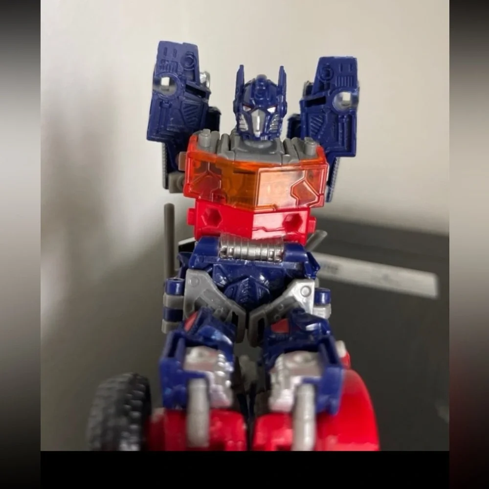 Hasbro Transforming Robot - Red, Blue, and Silver